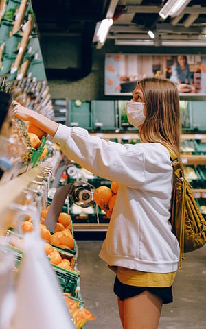 Woman shopping with COVID-19 mask